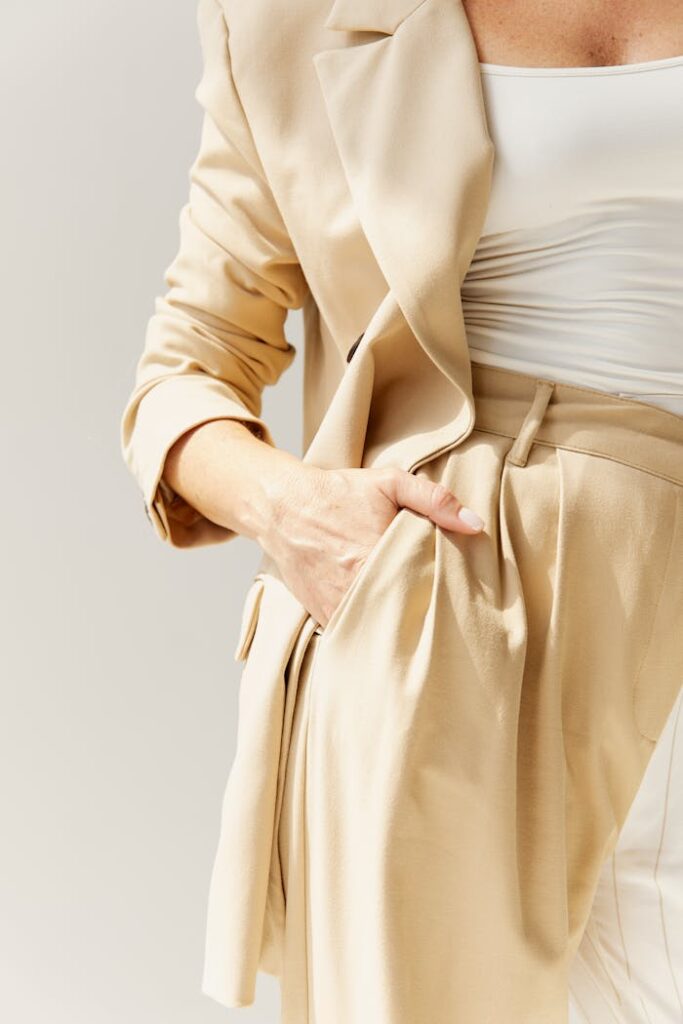 Close-up of a fashionable beige blazer and pants, showcasing modern elegance.